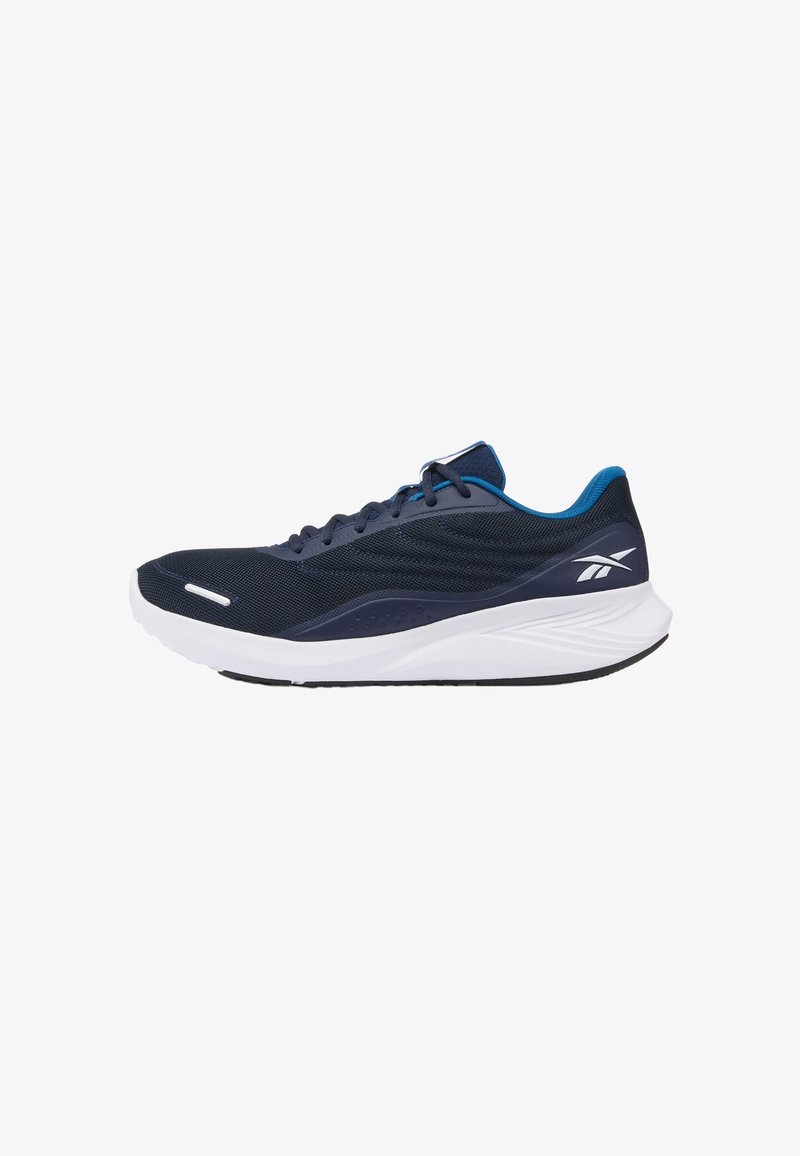 Chaussure de sport bleu marine avec semelle blanche, doublure intérieure bleue, tige en mesh et logo Reebok blanc sur le talon.