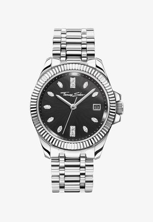 Montre-bracelet en métal argenté avec cadran noir, index en forme de diamant, fenêtre de date à 3 heures et logo Thomas Sabo sur le cadran.