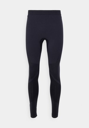 Czarne legginsy sportowe o dopasowanym kroju, z delikatną fakturą i panelem akcentującym dla zwiększenia komfortu i elastyczności.