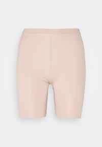 Lichtroze fietsbroekjes gemaakt van zachte, rekbare stof. Heeft een hoge taille en een aansluitende pasvorm, wat zorgt voor bedekking en comfort.