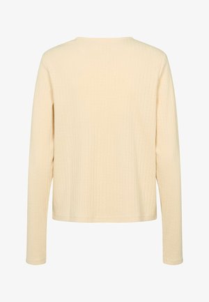 Krémově zbarvený dlouhý rukáv s žebrovaným pleteným topem s kulatým výstřihem, zobrazený zezadu.