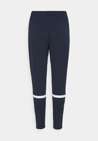 Marina träningsbyxor med elastiskt midjeband och vita horisontella ränder vid halva vaden. Tillverkade av ett slätt, stretchigt tyg.