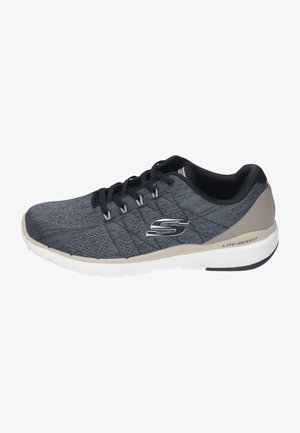 Gray athletic shoe with a textured mesh upper, black laces, and a cushioned white sole. Features a silver logo and lightweight design.