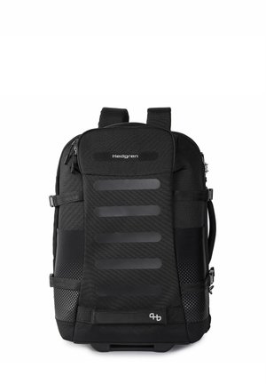 Sac à dos Hedgren noir avec bretelles rembourrées, compartiments avant et latéraux, et design texturé horizontal sur le panneau avant.