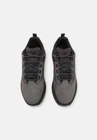 Gray outdoor shoes with a suede upper, black rubber sole, and textured laces. Features a padded collar and pull tab for easy wear.