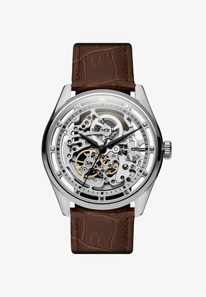 Sølv skelet ur med en brun krokodillemønster læderrem, der har indviklede tandhjulsdetaljer og sorte time markører.