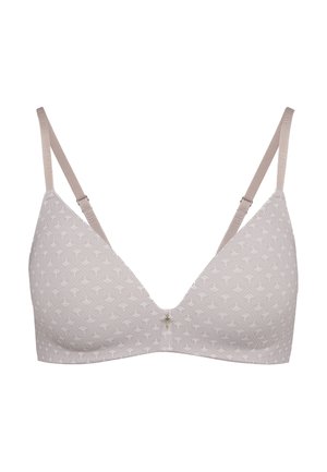 Hellbeiger BH mit dezentem Fächer- und Punktmuster, verstellbaren Trägern und kleinem dekorativem Anhänger vorne in der Mitte.