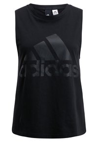 Czarny bezrękawnik sportowy wykonany z bawełny, z wyraźnym czarnym logo Adidas na przodzie. Gładka faktura, klasyczny krój.