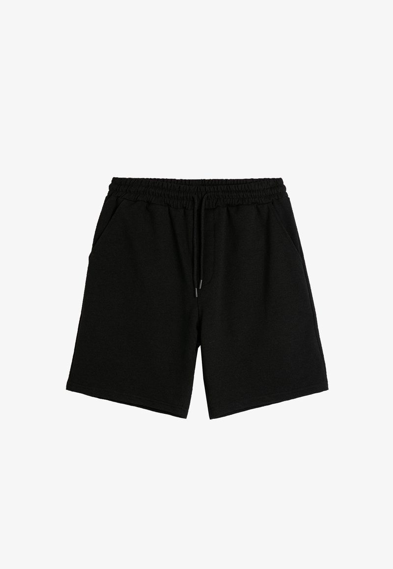 Pantalones cortos de sudor negro, hechos de una suave mezcla de algodón, con una cintura elástica y cordón, dos bolsillos laterales y un corte recto.
