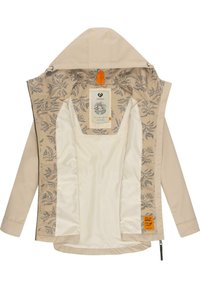 Beige színű, kapucnis dzseki virágmintás bélésborítással. Zipperes záródással, két oldalsó zsebbel és egy feltűnő logó címkével rendelkezik a belső oldalon.