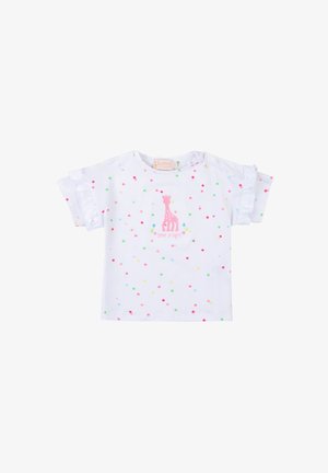 Camicetta bianca a maniche corte con dettagli in ruffle e pois multicolori. Presenta un design di giraffa rosa sul davanti. Tessuto in cotone morbido.