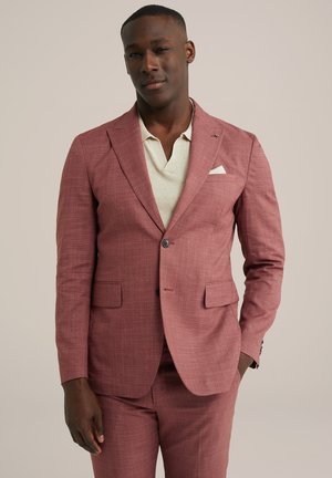 Light red blazer with a textured pattern, single-button closure, notch lapels, and two front pockets, paired with a cream polo shirt.
