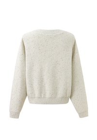 Pull en maille beige clair avec un motif moucheté, col et poignets côtelés, coupe ample et dos uni.
