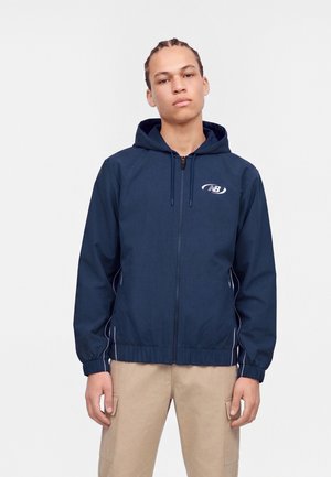 New Balance, TRACKSIDE JACKET - Лятно яке - navy