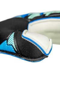 Close-up of black, blue, and white padded sports glove with reinforced white knuckle protection and textured blue design details.