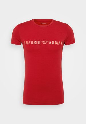Red short-sleeve t-shirt made of cotton, featuring a white "Emporio Armani" logo printed across the chest in a bold, modern font.