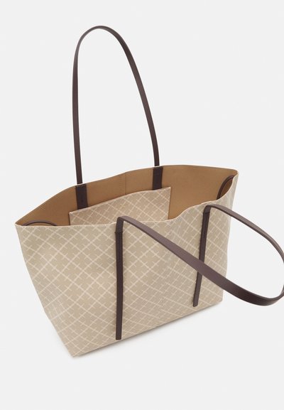 Beige tote bag with a geometric pattern, brown leather straps, open top, and a spacious interior featuring a coordinating inner pocket.