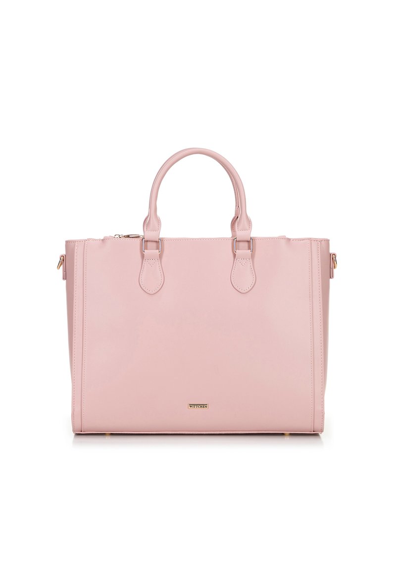 Light pink rectangular tote bag with dual handles, gold-tone hardware, and a small brand logo plaque on front center.