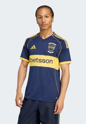 Navy blue sports jersey with yellow accents, featuring a v-neck, short sleeves, and sponsor logo "betsson" across the chest.