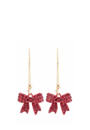 Gold hook earrings with red crystal-studded bow-shaped charms hanging below the hooks, displayed against a white background.