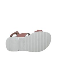 Sandaliera rosa con suola bianca testurizzata, cinturino regolabile e dettagli floreali. La suola presenta scanalature orizzontali per una migliore aderenza.