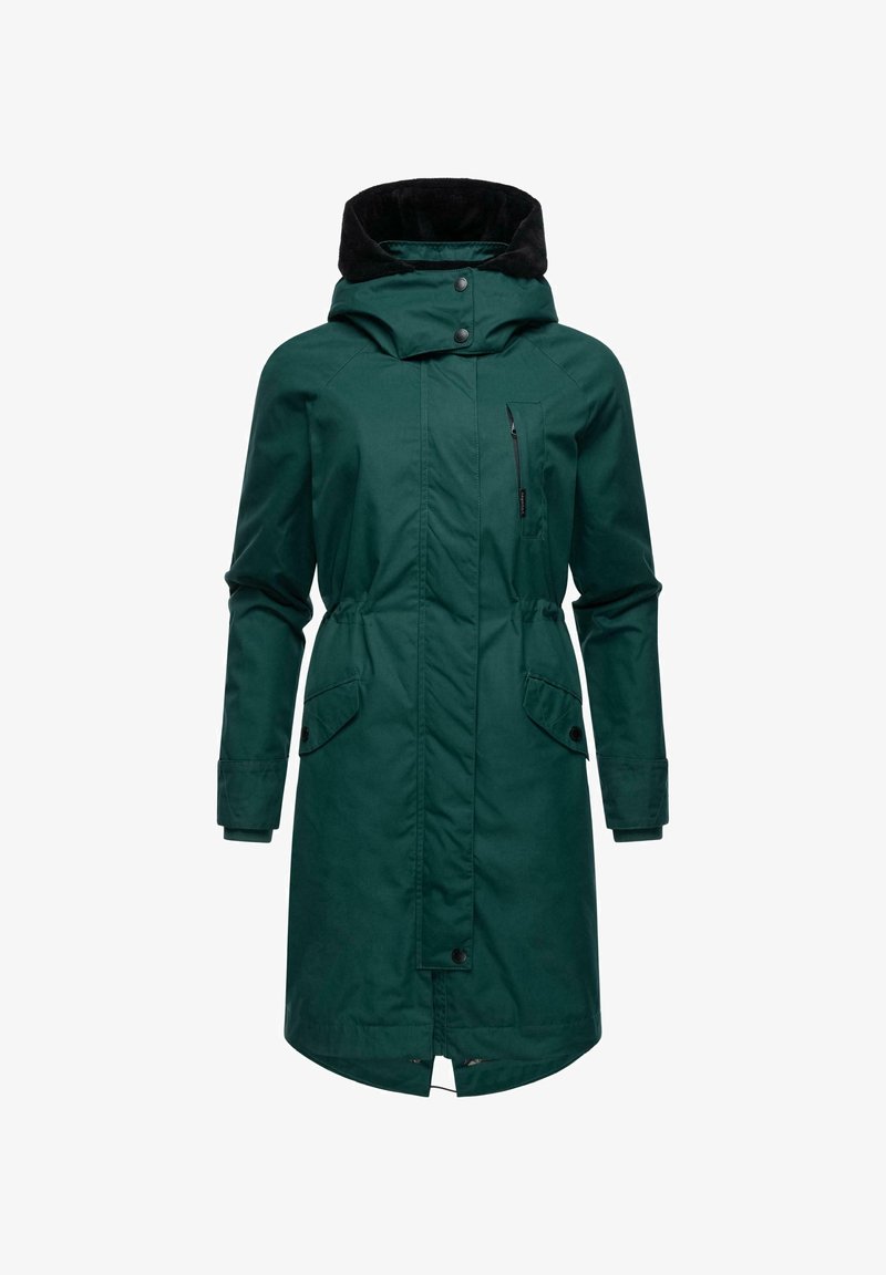 Zaļš garš mētelis ar melnu kažokādas odere ap kaklu, priekšējais rāvējslēdzējs un spiedpogas aizdare, divi sānu kabatu un krūšu kabata glabāšanai.