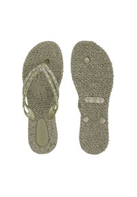 Infradito beige con suola testurizzata, caratterizzate da due cinturini intrecciati decorati con piccoli strass trasparenti per un tocco di eleganza.