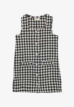 Abito senza maniche a scacchi bianco e nero con scollo rotondo, chiusura a bottoni e due tasche frontali. Realizzato in tessuto testurizzato.
