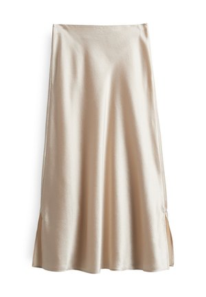 Jupe en satin de couleur beige clair, présentant une texture douce, un design évasé et des fentes latérales pour faciliter le mouvement.