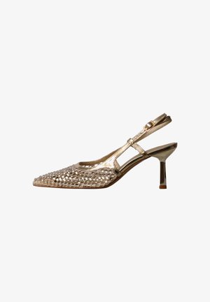 Gold slingback high heel shoe with pointed toe and decorative studs on the front, featuring a thin adjustable ankle strap.