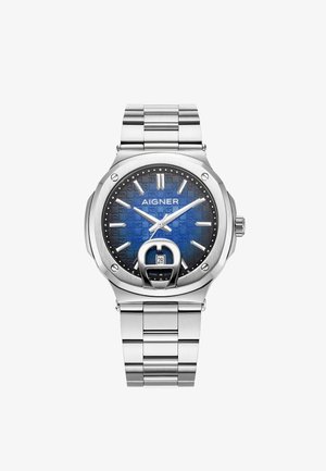 Sidabrinis nerūdijančio plieno laikrodis su tekstūruotu mėlynu ciferblatu, įskaitant valandų žymeklius, datos rodymą 6 valandą ir apvalaus korpuso dizainą.