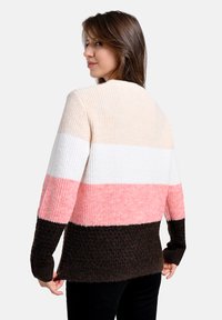 Langärmliger Pullover mit Blockmuster in Beige, Weiß, Rosa und Braun. Strukturierter Stoff mit gerippten Bündchen und Saum. Lässige Passform.