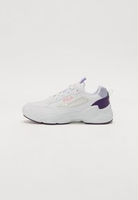 White athletic sneaker with purple and green accents, featuring a textured synthetic upper, padded collar, and laces. Brand logo displayed.