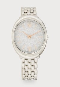 Silver metal watch with a rounded case, textured shimmering silver dial, rose gold hour markers, and a linked bracelet strap.