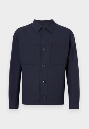 Navy blue button-up jacket made of fabric with a smooth texture. Features two chest pockets and a pointed collar, with four front buttons.