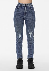 High-waisted blue jeans with a faded texture, featuring ripped details on the front and a classic five-pocket design.