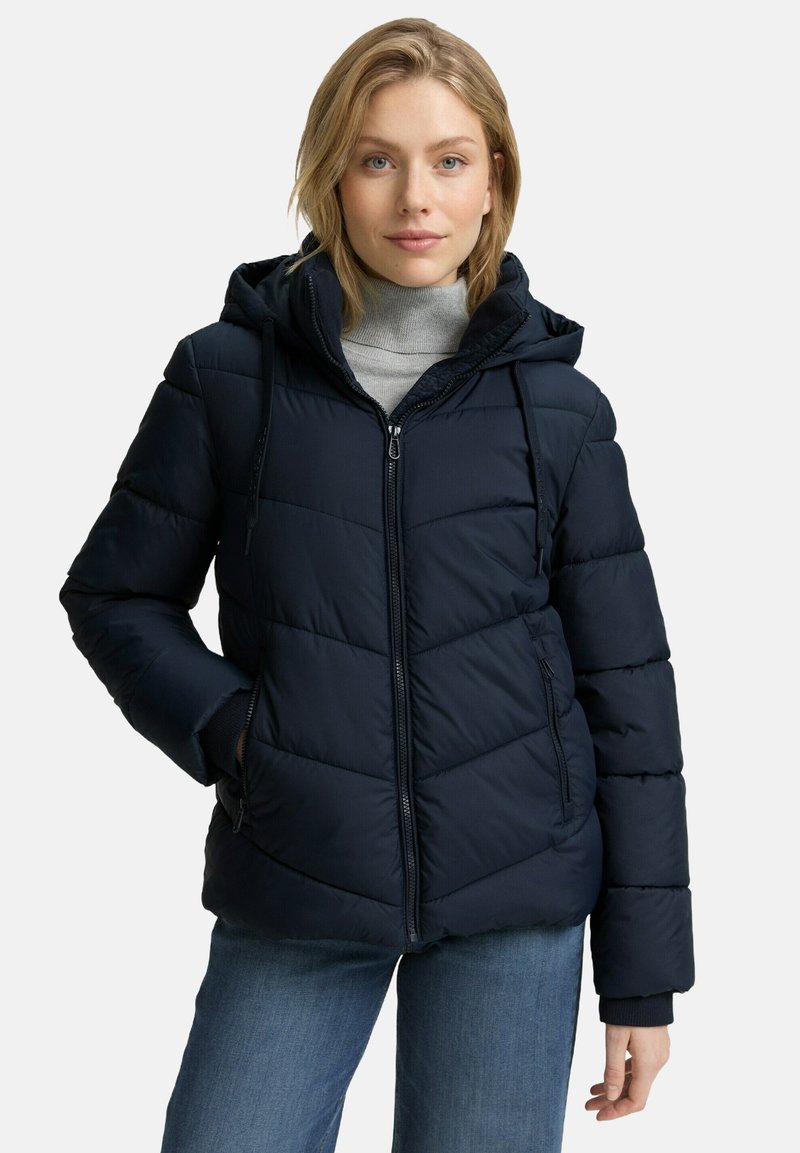 Marineblaue Steppjacke mit Kapuze, Reißverschluss und horizontalem Steppmuster. Weicher Stoff mit elastischen Bündchen und seitlichen Taschen.