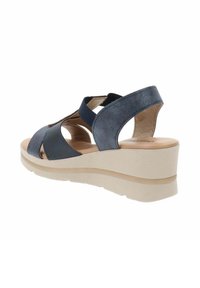 Infradito navy con punta aperta, design con ritagli, materiali in suede ed elastico, suola piatta beige chiaro con superficie texturizzata.