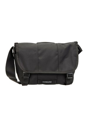 Black Timbuk2 messenger bag with adjustable shoulder strap, flap closure, and two front buckle clips. Bag appears new and unused.