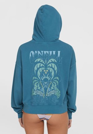 Turkis hoodie med et stort grafisk tryk, der viser palmeblade og teksten "O'NEILL SURF CO." i en retro stil. Blød, afslappet pasform.