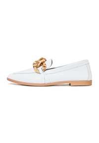 White leather loafer with a rounded toe, featuring a large tortoiseshell knot accent and a contrasting beige rubber sole.