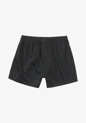 Zwarte katoenen boxers met een elastische tailleband, een opening aan de voorkant en een gladde textuur. De boxers hebben een losse pasvorm en een eenvoudig ontwerp.
