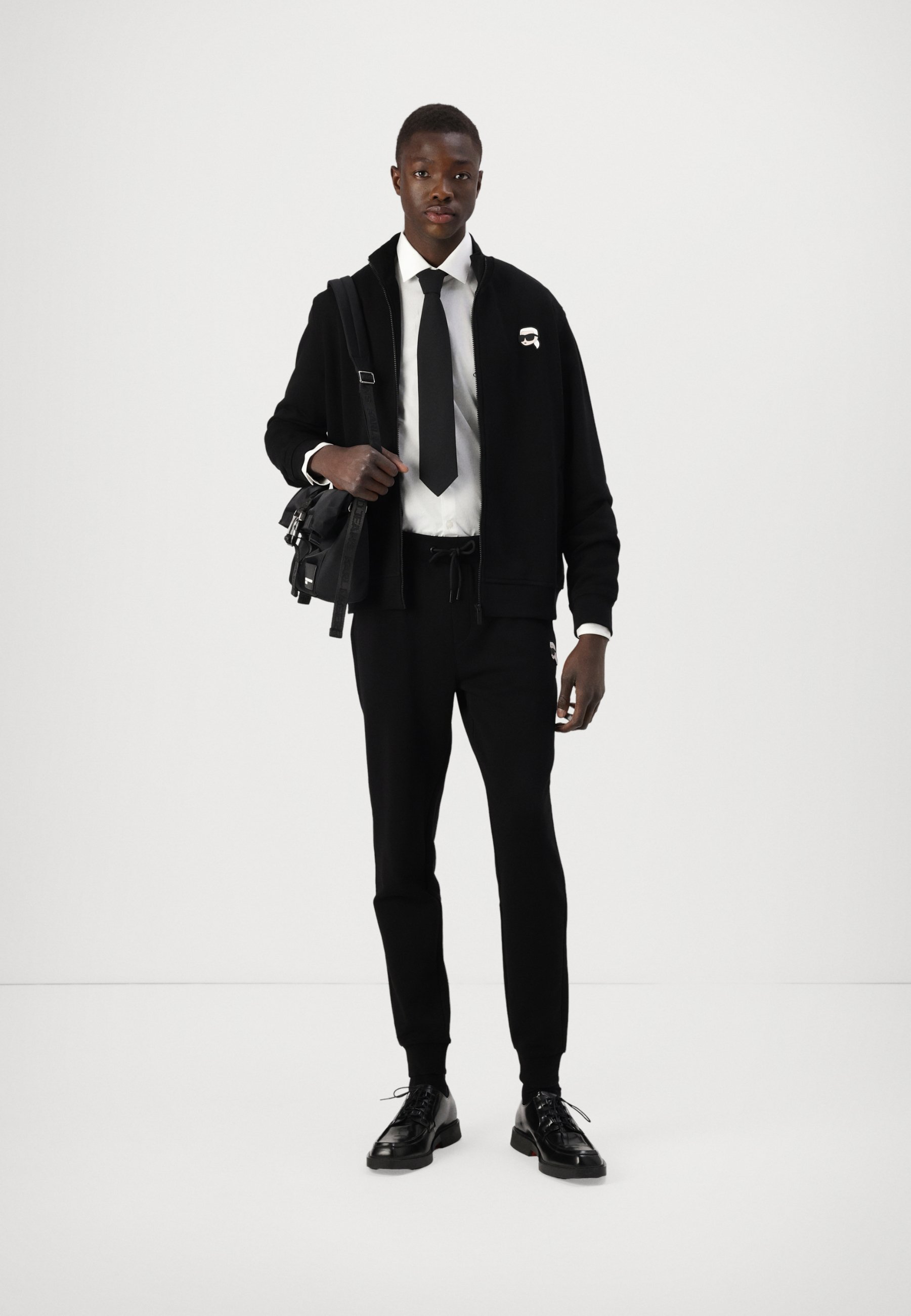 black blazer with white shoes