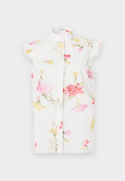 Balta trumpų rankovių marškiniai su aukštu apykakle, puoštas gėlių raštu rožinės, raudonos ir geltonos spalvų, su šiek tiek pūstu detaliu ant rankovių.