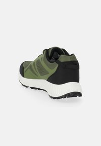 Athletic shoes in dark green and black with a white sole, featuring mesh panels, textured surface, and a padded collar for support.