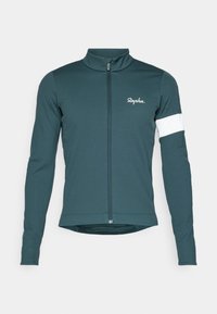 Jersey de ciclismo de manga larga en tela azul oscuro con cremallera frontal completa, que presenta acentos en blanco en las mangas y un pequeño logotipo blanco en el pecho.
