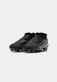 Pair of black and blue Nike soccer cleats with sock-like ankle collars and textured uppers, positioned on a white background.