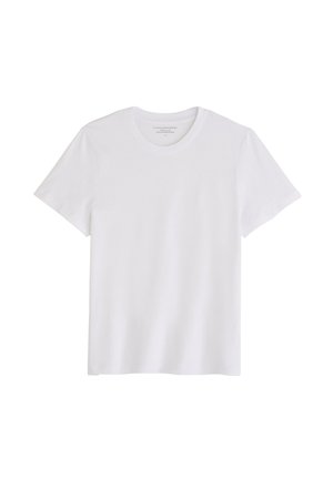 T-shirt en coton blanc à manches courtes, col rond et texture lisse. Ne présente aucun motif ni logo visible. Coupe standard.