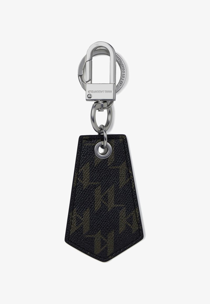 Nahkavõti kiire liiklusala, millel on tume mustri pind, hõbedane kinnitustasku ja võtmehoidja, rombi kujuline, teravate otstega.