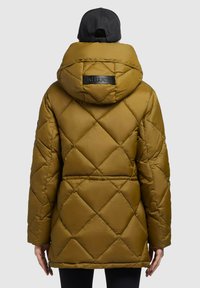 Brown quilted puffer jacket with a hood, featuring a black logo patch and boxed pattern. Back view shows a slightly tapered shape and seam details.